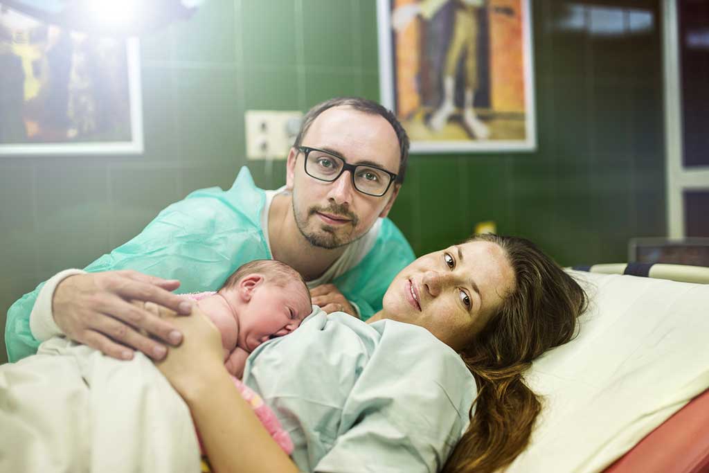 Mom and Dad with Newborn